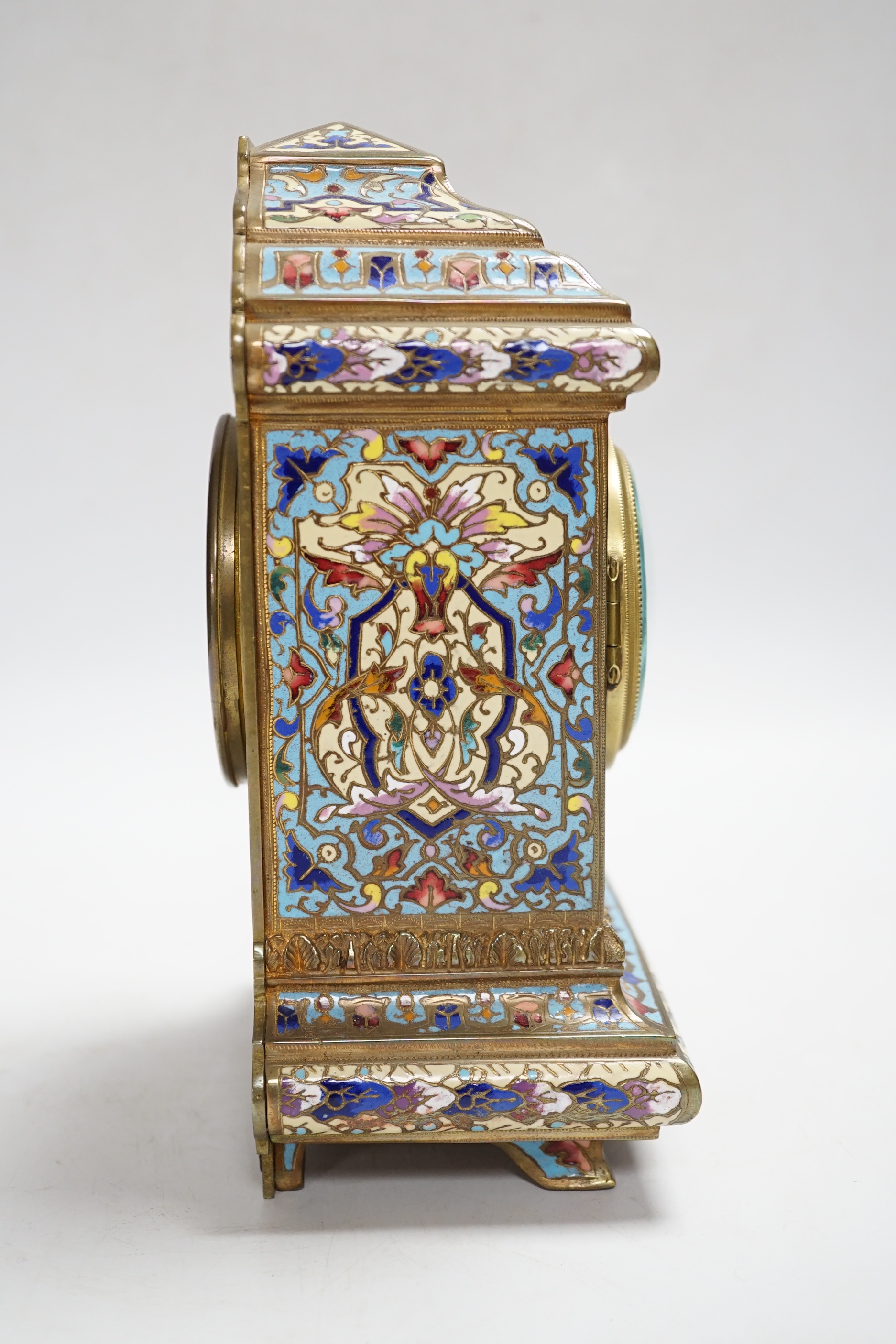 A French champlevé enamel mantel clock, 21cm